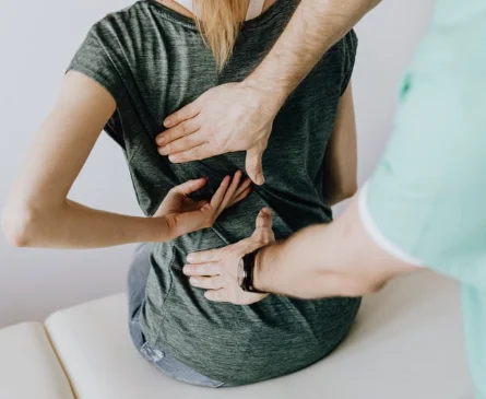 Chiropractor performing spinal adjustment on patient at North Lakes Chiropractic